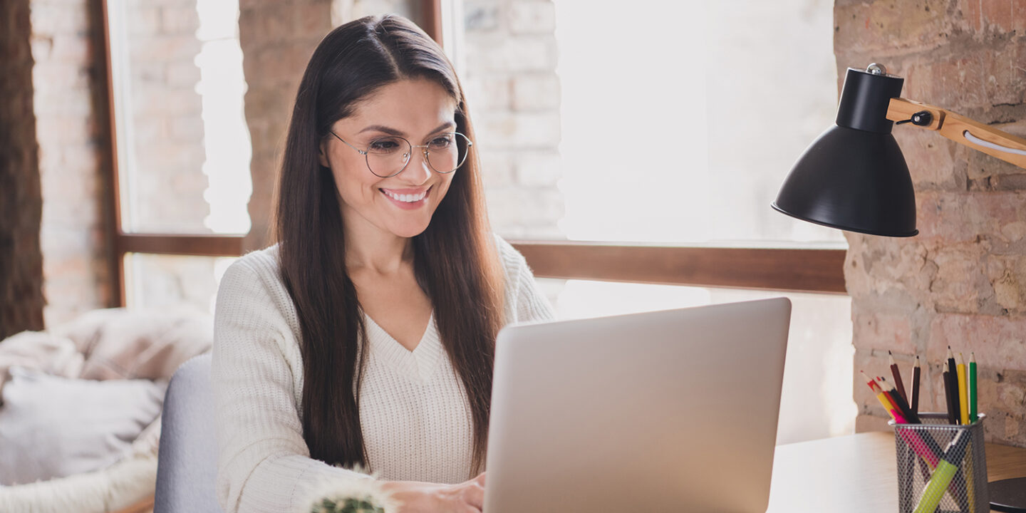 Woman happy working on CRM