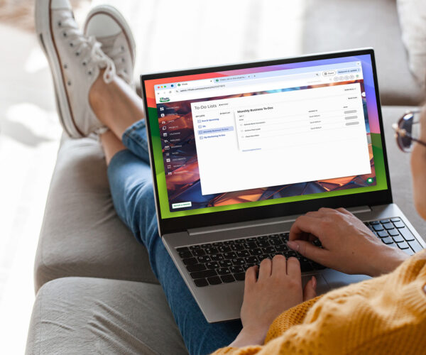woman working on laptop with 17hats To-Do Manager