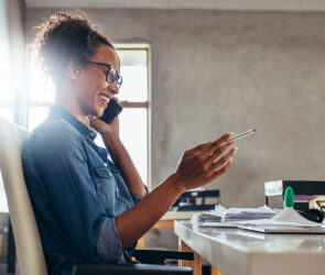Small business owner sending a personal follow-up message to an existing client from a laptop.