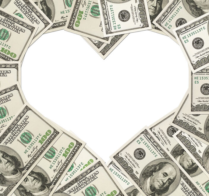 One hundred dollar bills arranged in the shape of a heart