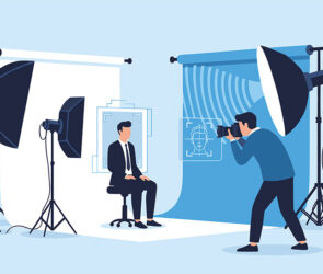 Illustration of a headshot studio with softbox lighting, a seated subject in a suit, and a photographer